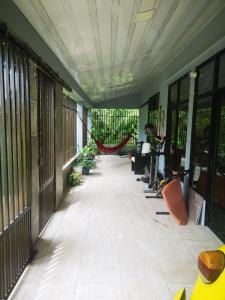 a hallway of a building with plants at Casa amazilia in Leticia