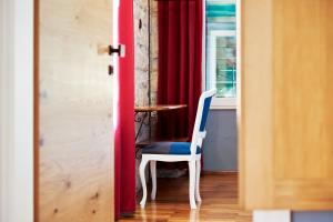 a room with a table and a chair and a window at Domus Maritima in Trogir