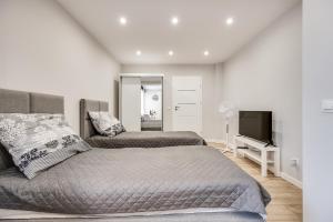 Ένα ή περισσότερα κρεβάτια σε δωμάτιο στο Central Platinum Apartments 30