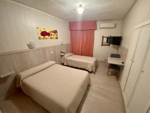 Кровать или кровати в номере Hotel Real Castellon