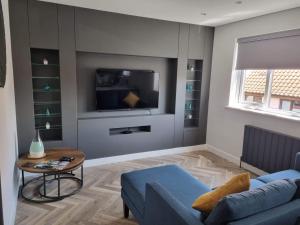 TV a/nebo společenská místnost v ubytování Holiday Apartment Beverley