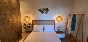 Posteľ alebo postele v izbe v ubytovaní Costa ANASTASIA_sea view suites