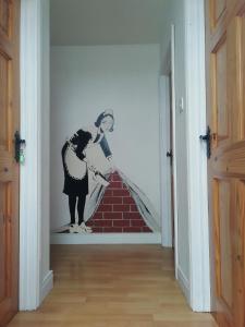 a mural of two women on a wall in a room at LOCH CONNELL LODGE in Letterkenny
