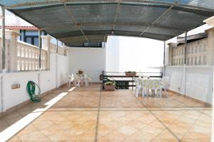 a large room with tables and chairs in a building at Tavernetta Benedetto in Torre Santa Sabina