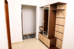 a closet with wooden shelves and a door at Krichim Apartments,Three-Bedroom, large apartment, TOP CENTER in Sofia