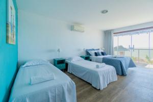 Un ou plusieurs lits dans un hébergement de l'établissement Morada do Sol Guest House 2