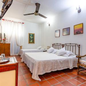 Giường trong phòng chung tại Hotel Casa de Las Palmas