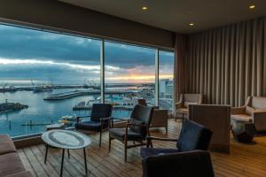a hotel room with a view of a harbor at Octant Ponta Delgada in Ponta Delgada