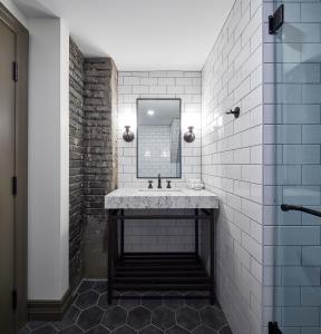 A bathroom at The Metcalfe Hotel - Recently Renovated