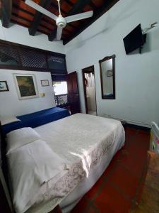 Postel nebo postele na pokoji v ubytování Hotel Casa de Las Palmas
