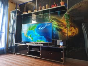 a living room with a flat screen tv on a stand at Romantic - Garaje Incluido & ApartamentosAltea in Altea