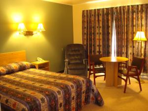 Motel Le Campagnard de Matane tesisinde bir odada yatak veya yataklar