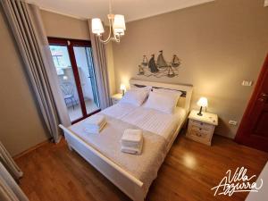 Postel nebo postele na pokoji v ubytování Villa Azzurra