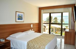 
A bed or beds in a room at Praiamar Natal Hotel & Convention
