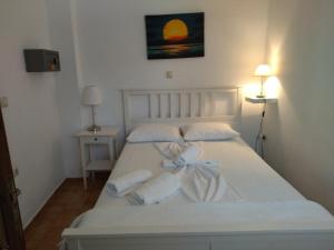 Posteľ alebo postele v izbe v ubytovaní Ostria Apartments Kalives