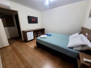 Postel nebo postele na pokoji v ubytování Hotel Serra do Mar