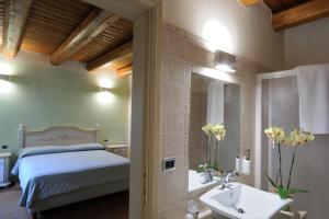Postel nebo postele na pokoji v ubytování Agriturismo I Leprotti