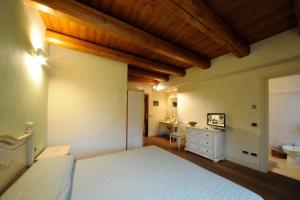 Postel nebo postele na pokoji v ubytování Agriturismo I Leprotti