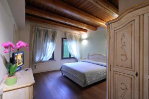 Postel nebo postele na pokoji v ubytování Agriturismo I Leprotti