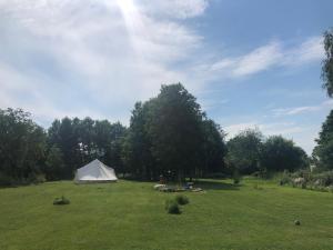 a white tent in the middle of a field at Lahemaa Glamping in Viinistu