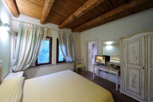 Postel nebo postele na pokoji v ubytování Agriturismo I Leprotti