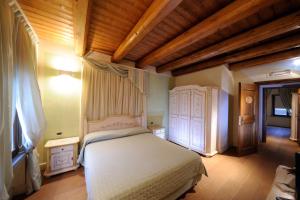 Postel nebo postele na pokoji v ubytování Agriturismo I Leprotti