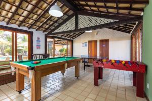 a room with two pool tables in a house at Casa em Búzios com vista mar e piscina | EDF 12 in Búzios