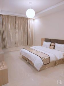 Giường trong phòng chung tại جولدن السودة