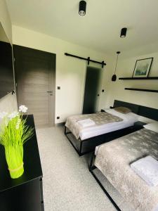 Villa Makuchówka客房内的一张或多张床位