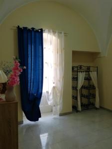 A bed or beds in a room at L 'Alcova Holidays Home CENTRO STORICO