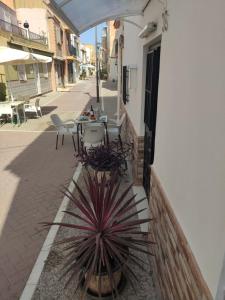 a table and chairs sitting on a patio at Casita La Playa in Málaga