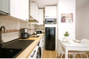 Virtuvė arba virtuvėlė apgyvendinimo įstaigoje Apartamento Las Palmas