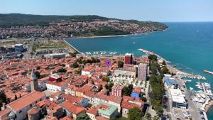 an aerial view of a city next to the water at Santoria Casa in Koper