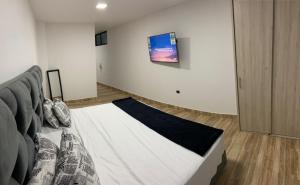 Cama o camas de una habitación en Aparta Suites 404 Granada Cali