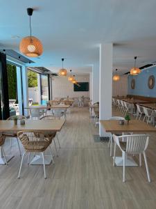 a dining room with tables and chairs and a cafeteria at Krystal Boutique Mansion in Hunedoara