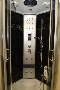 a bathroom with a shower with a glass door at Dreams tivat in Tivat +21 photos