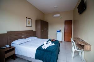 Ένα ή περισσότερα κρεβάτια σε δωμάτιο στο Hotel Flor de Lotus Comfort +31 φωτογραφίες