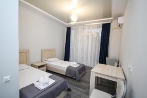 Postel nebo postele na pokoji v ubytování Guest House 99