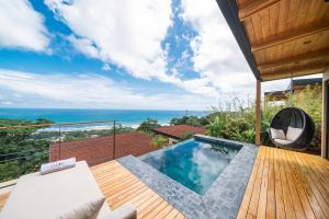 an ocean view from a villa with a swimming pool at LALOON Luxury Suites - Adults Only in Santa Teresa Beach