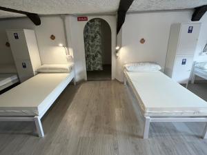 Posteľ alebo postele v izbe v ubytovaní HOSTEL PORTON