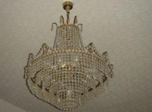 a large chandelier hanging from a ceiling at St David's Guesthouse in Haverfordwest