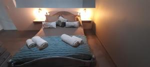 a bedroom with a bed with pillows on it at Aires de Ambar in Merlo +75 photos