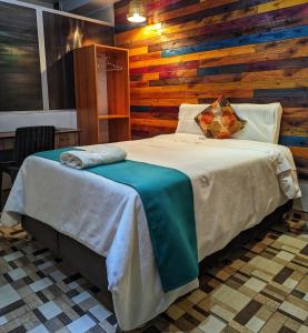 Säng eller sängar i ett rum på Sumaq Wari Hotel