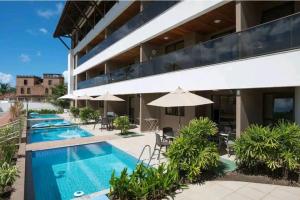 an image of a building with a swimming pool at Flat em Porto de Galinhas com Piscina Exclusiva in Porto De Galinhas