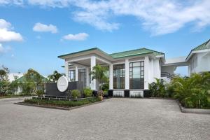 a rendering of a house with a driveway at Radisson Resort Pondicherry Bay in Pondicherry