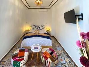 Säng eller sängar i ett rum på Riad Dar Yassine