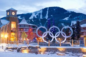 a hotel with the olympic rings in the snow at Ski In Ski Out 3BR Townhome in Creekside by Harmony Whistler in Whistler