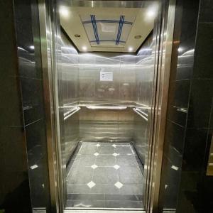 a elevator in a bathroom with a tile floor at Atlantis@531 in Singapore