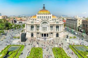 a large building with a gold dome on top of it at HOM Centro histórico in Mexico City