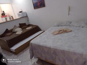 A bed or beds in a room at STUDIO Centro Lacerda